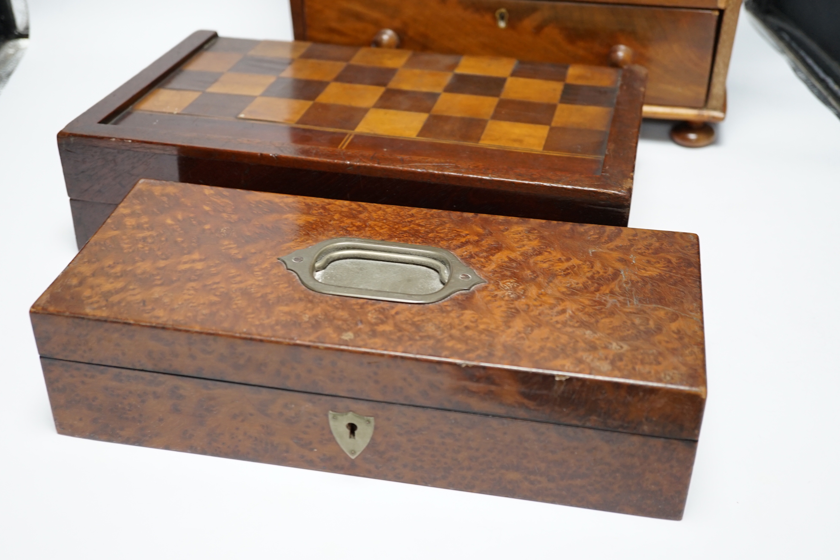 A Victorian mahogany miniature four draw chest, an amboyna glove box and a games box